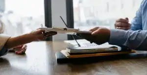 Home 21 Recruiter reviewing candidate cvs as part of a fair hiring process